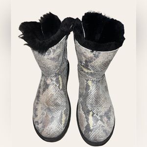Used UGG Australia Women's Mini Bailey Bow Snake print boots.